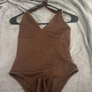 Brown body suit